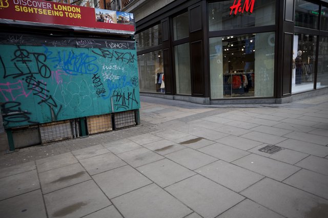 Urban Streetscape with Graffiti Kiosk and H&M Store