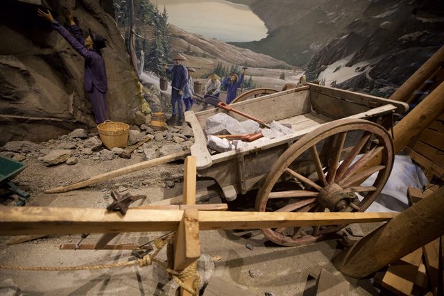 Historical Mining Diorama with Wooden Cart and Workers