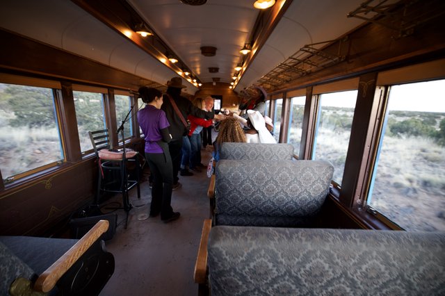 Scenic Train Journey Through Desert Landscape at Dusk