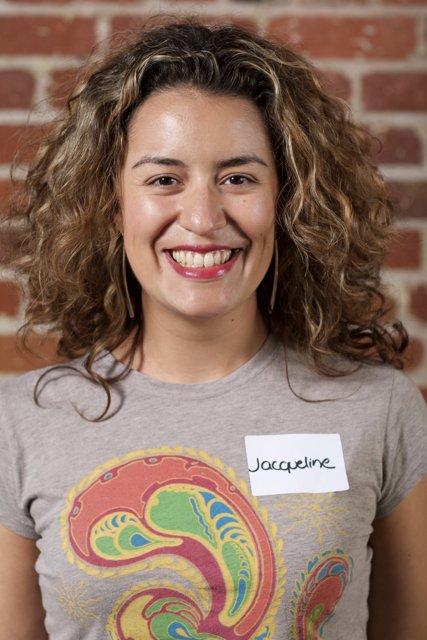 Curly-haired Woman in Patterned T-Shirt