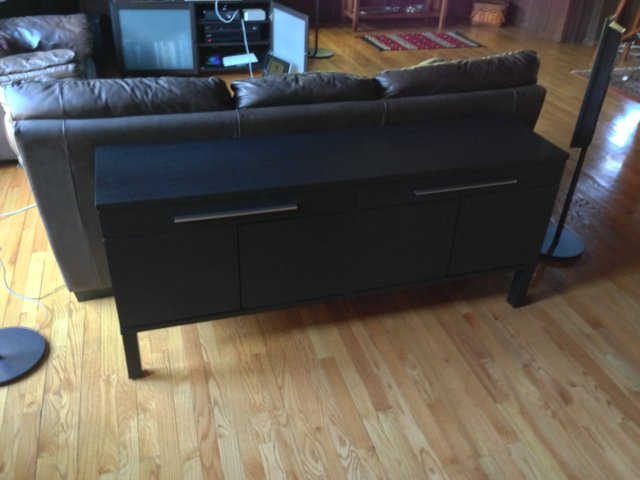Black Sideboard with Drawers in a Chic Living Room
