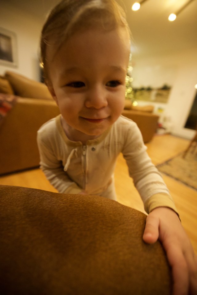 Joyful Toddler Playing at Home During Christmas Season