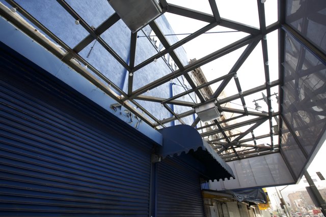 Blue Building with Metal Roof and Sign