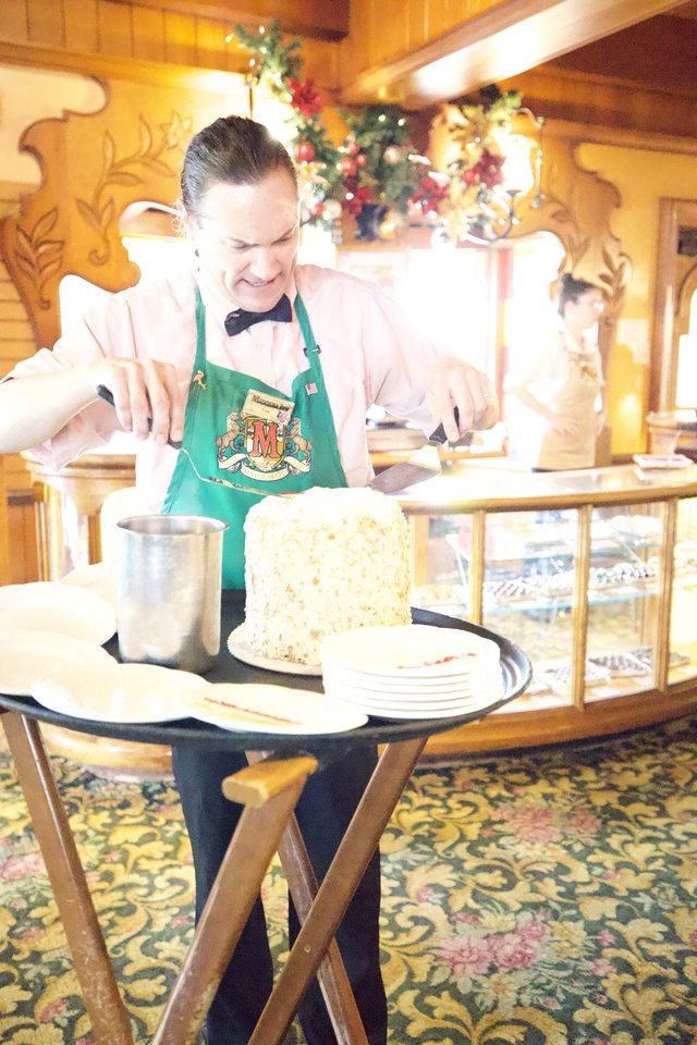 Server Preparing Dessert Tableside at Holiday Restaurant