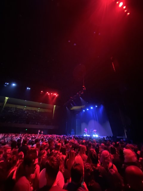 Red-Lit Concert Crowd at Bill Graham Civic Auditorium