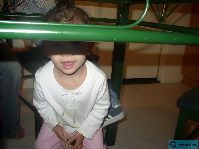Little girl taking a break in the indoor play area