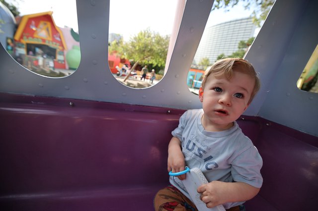 Toddler's Playful Moment at Theme Park Playground