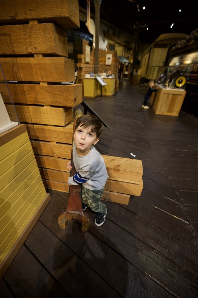 Young Boy Explores Interactive Maritime History Museum