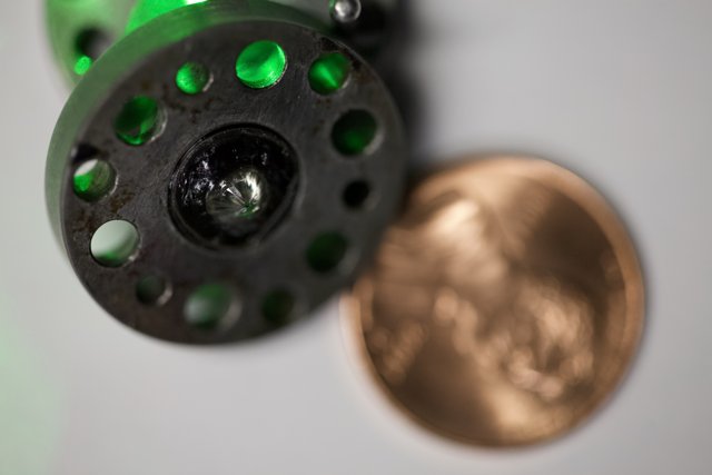 Close Up of Coin and Fly Reel