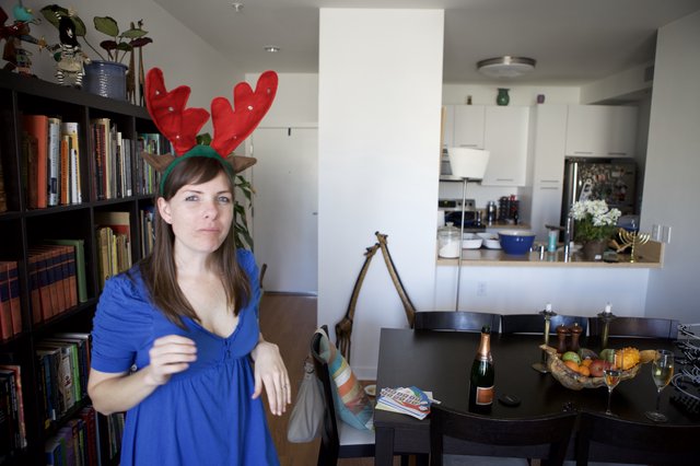 Unamused Woman in Reindeer Antlers on Christmas Day