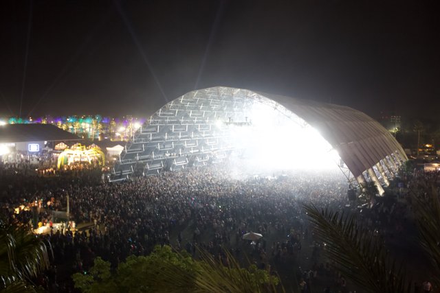A Night Under the Dome Caption: The crowd gathers beneath the illuminated dome for an unforgettable concert experience at Coachella 2015.