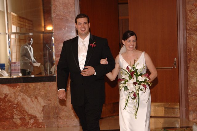Newlyweds Radiate Joy Walking from Ceremony