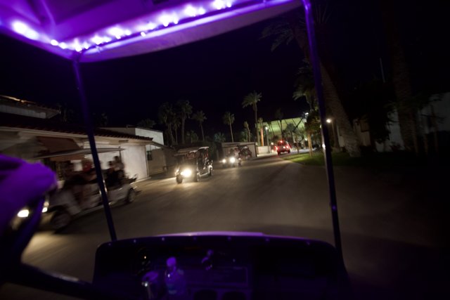 Nighttime Cruise on a Purple Lit Golf Cart