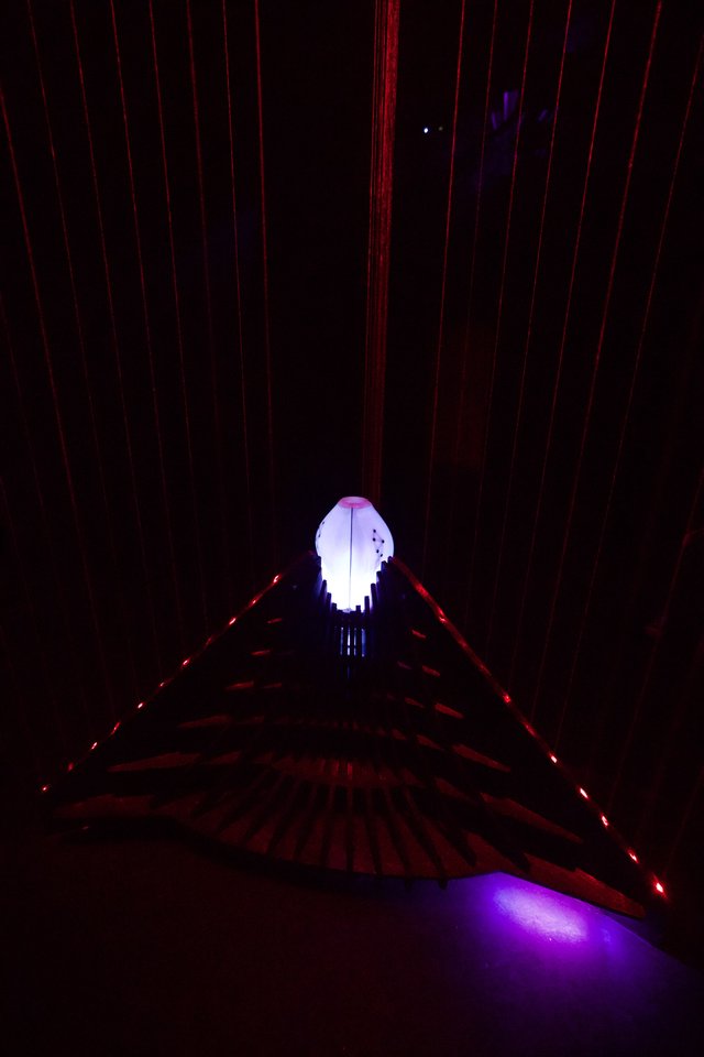 Illuminated Ghost Figure in Laser Light Installation