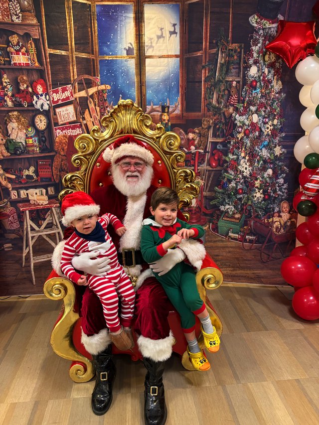 Santa's Workshop Visit with Two Happy Children