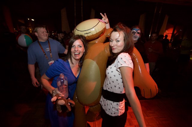 Friends Pose with Inflatable Scooby-Doo at Party