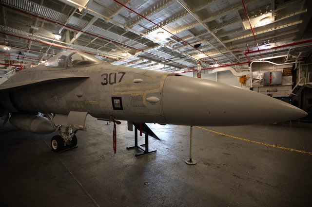 F/A-18 Hornet Fighter Jet in Aircraft Carrier Hangar Bay