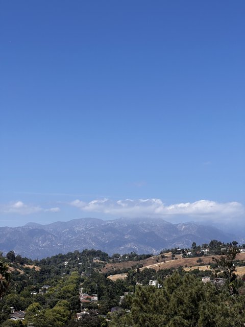 Majestic Mountains in a Cloudy Sky