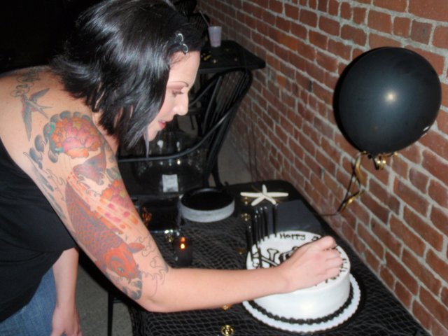 Tattooed Woman Celebrates Nate's Birthday with Cake