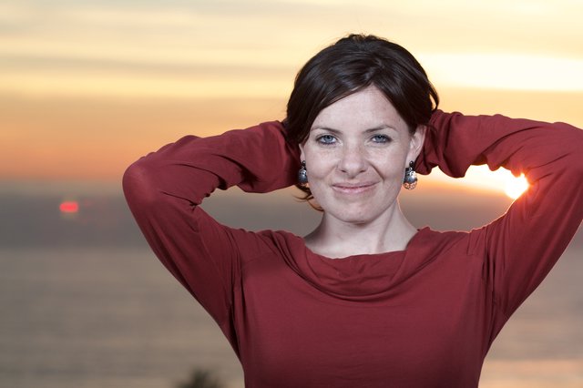 Woman in Red at Golden Sunset by the Sea