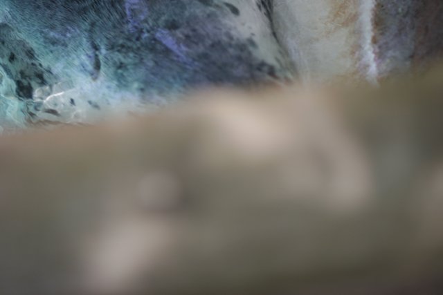 Close-up of a Rock with Blue and Green Background