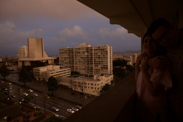 Newlyweds on Balcony at San Francisco Dusk