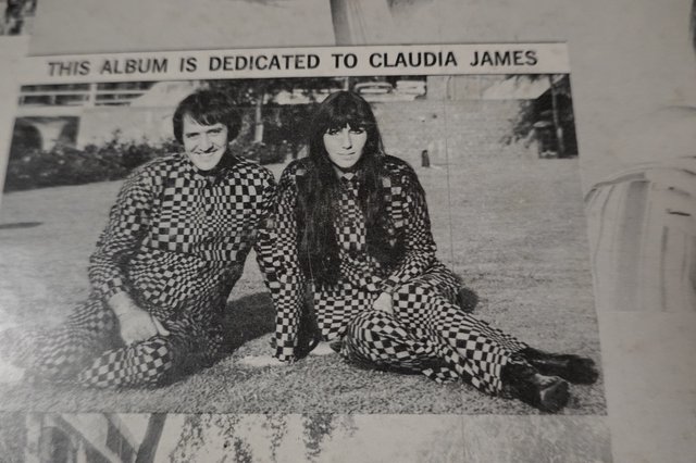 Duo in Matching Checkered Outfits Album Dedication