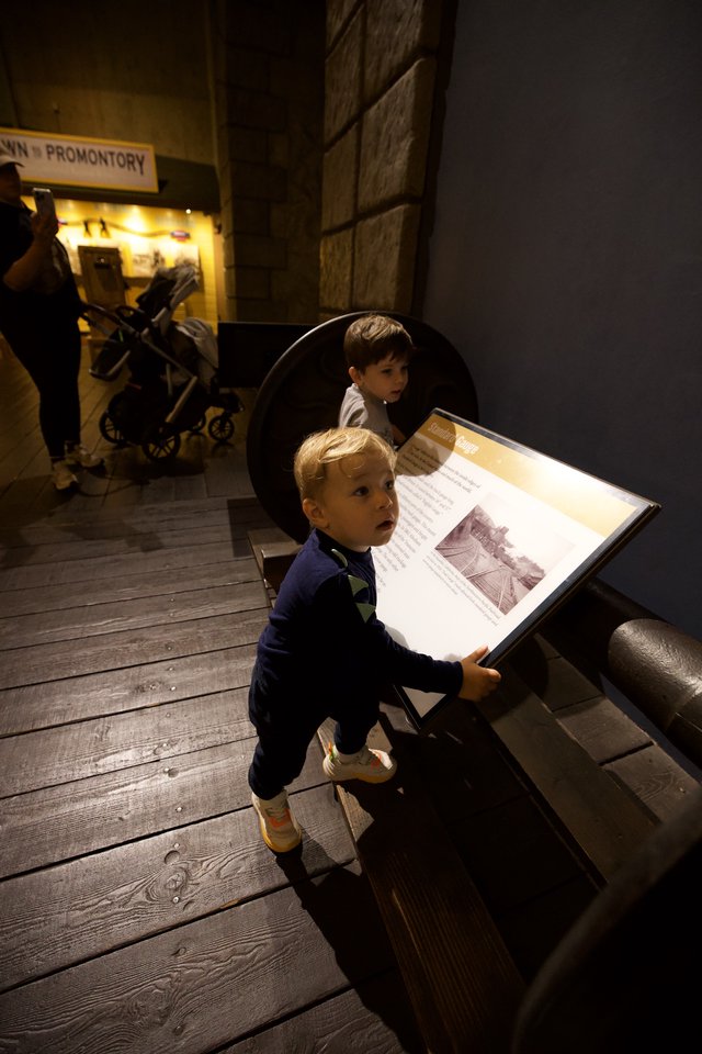 Young Boy Engaged in Museum Learning Experience