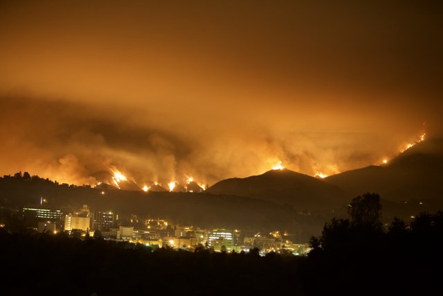 Flames Engulf Hills Above City