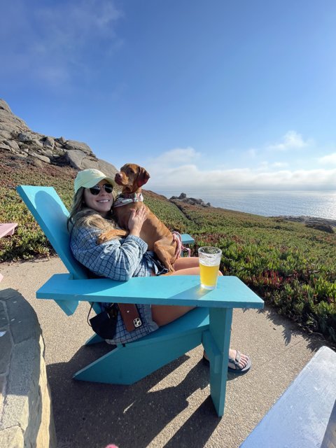 Woman and her Furry Companion Enjoy the Scenic Beauty of Jenner