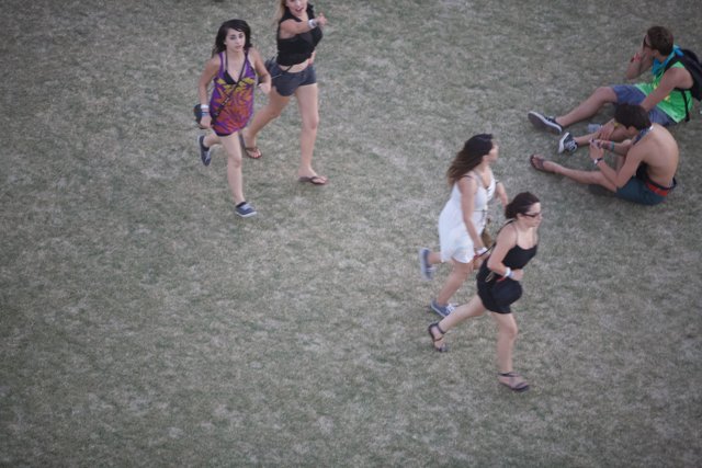Three Friends Enjoy a Relaxing Stroll at Coachella Festival