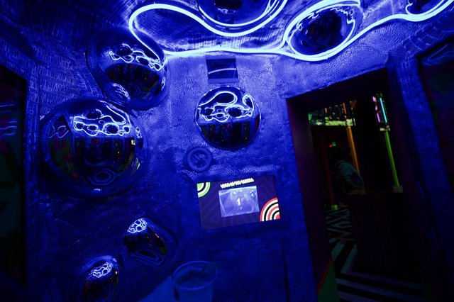 Immersive Blue UV Light Installation in Interactive Art Space