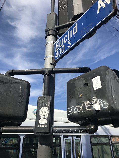 Stickered Sign on Sunny LA Street