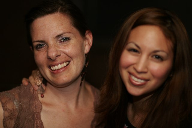 Two Women Smiling at a 2006 Social Gathering