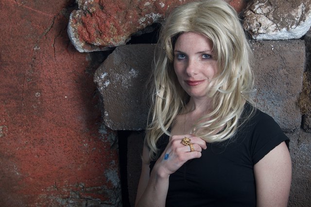 Blonde Halloween Costume Portrait Against Stone Wall