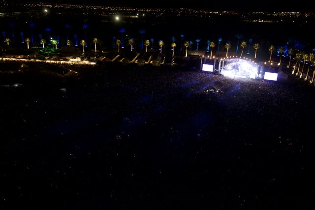 Bright Lights and Booming Beats: A Nighttime Concert Aerial View