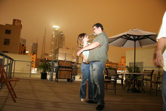 Rooftop Romance Dancing Under Smoky City Skies