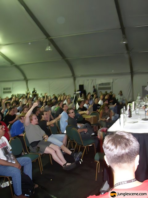 Speaker Addressing a Packed Tent