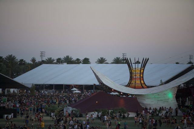 Concertgoers gather around large tent at Coachella Festival