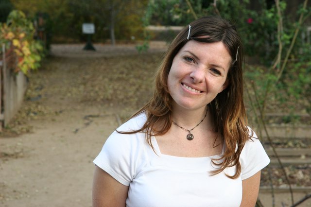 Smiling Woman in White Tee at Outdoor Park