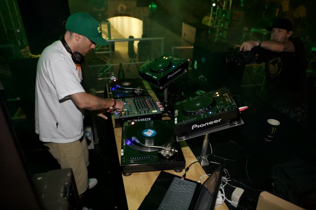 Green Hat DJ Table Performance