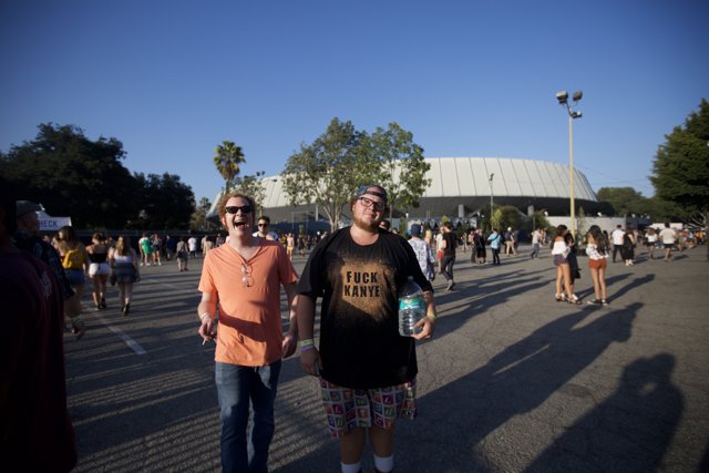 Two Men in Front of the Stadium