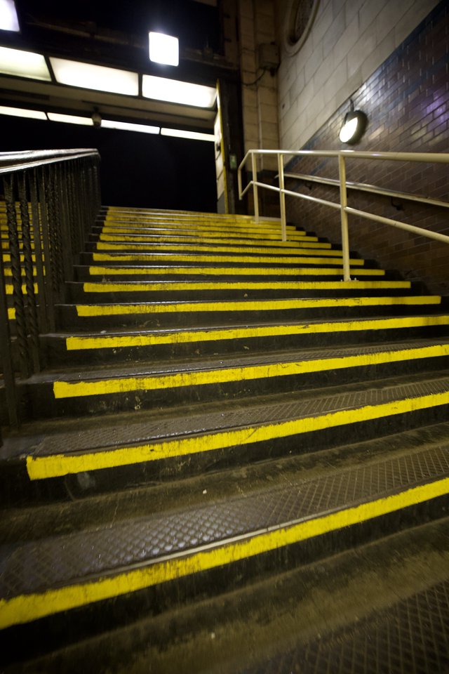 Yellow-Striped Industrial Stairs in London Underground Station