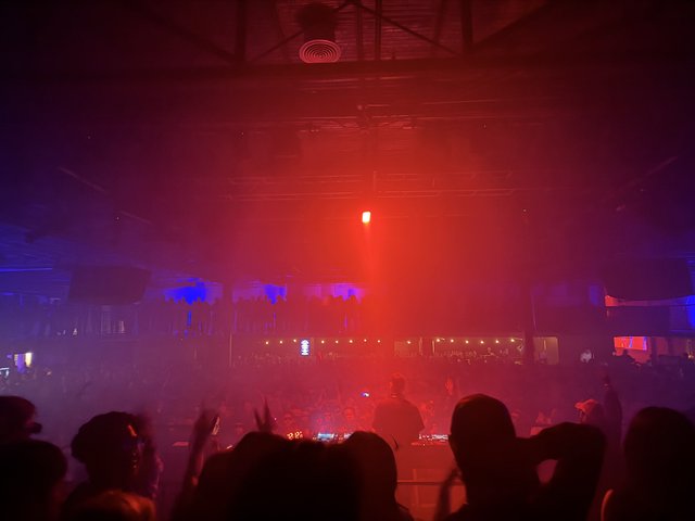 Skrillex Concert in Atmospheric Red Stage Lighting
