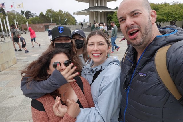 Joyful Group Selfie at Memorial Monument