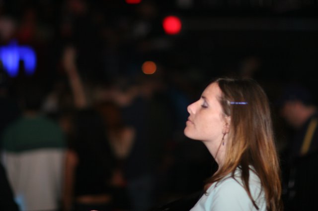Young Woman Lost in Thought at Nightclub Event