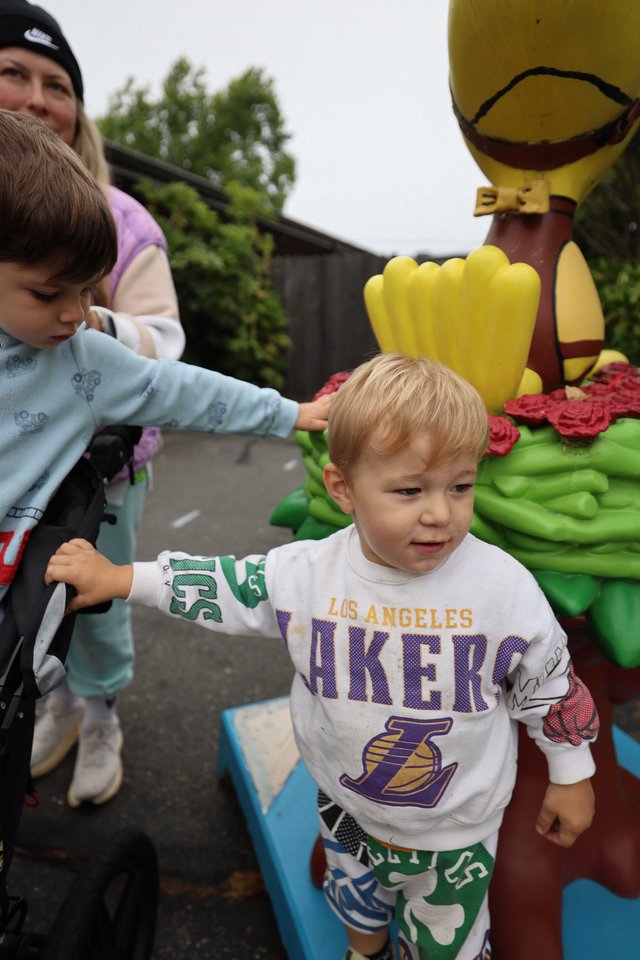 Young Children Explore Hot Air Balloon Festival Sculpture