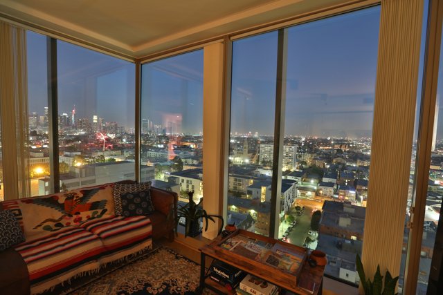Nighttime cityscape from a Penthouse living room
