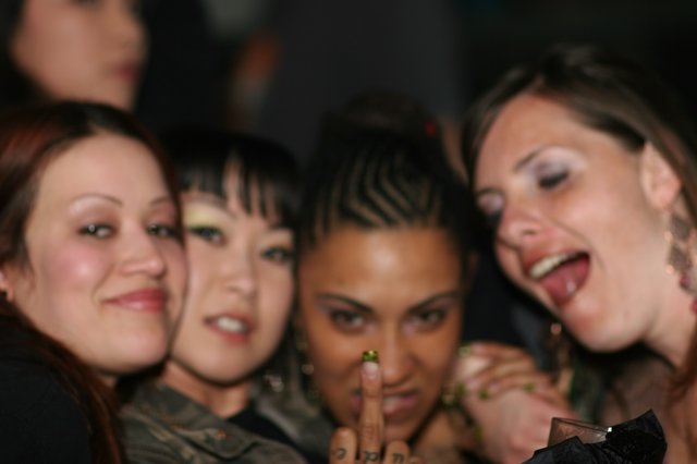 Four Friends Posing at Late Night Party Event