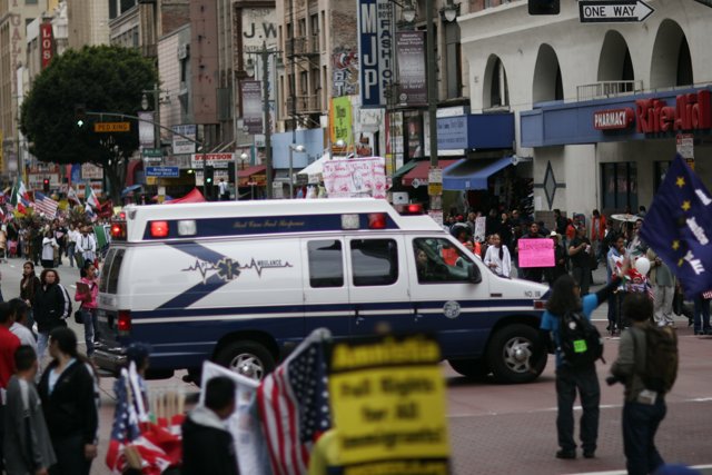 Student Protesters and Ambulance on City Street
